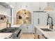 This kitchen offers marble backsplash, stainless steel appliances, and custom shelving at 2218 S Occident St, Tampa, FL 33629