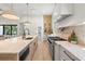 Bright kitchen showcasing stainless steel appliances, a spacious island and eat-in breakfast area at 2218 S Occident St, Tampa, FL 33629