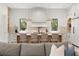 Modern kitchen featuring an island with seating, marble countertops, and stainless steel appliances at 2218 S Occident St, Tampa, FL 33629
