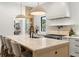Kitchen features a center island with seating, ample counter space, and modern finishes at 2218 S Occident St, Tampa, FL 33629