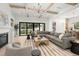 Large living room with fireplace, sliding glass doors, and comfortable seating at 2218 S Occident St, Tampa, FL 33629