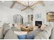 Spacious living room with coffered ceilings, fireplace, and built-in shelving at 2218 S Occident St, Tampa, FL 33629