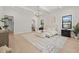 Main bedroom featuring light wood floors, lots of windows, and ensuite bathroom at 2218 S Occident St, Tampa, FL 33629