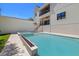 The in-ground pool features a spa and lounge area, surrounded by manicured landscaping and patio at 2218 S Occident St, Tampa, FL 33629