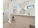 Modern tiled shower featuring glass enclosure, rain shower head, and a built-in shampoo niche at 2218 S Occident St, Tampa, FL 33629