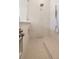 Spacious walk-in shower with rain shower head and handheld sprayer in a modern bathroom design at 2218 S Occident St, Tampa, FL 33629