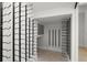 A contemporary wine storage area with multiple wall-mounted wine rack rows at 2218 S Occident St, Tampa, FL 33629