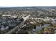 Scenic aerial view of a neighborhood, showcasing residential buildings, streets, and a tranquil pond at 2679 Sabal Springs Cir # 102, Clearwater, FL 33761