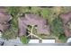 Bird's-eye view showcases the meticulously landscaped courtyard, walkways, and rooftops of the community buildings at 2679 Sabal Springs Cir # 102, Clearwater, FL 33761