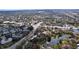 Scenic aerial view of the neighborhood, highlighting mature trees and a serene pond at 2679 Sabal Springs Cir # 102, Clearwater, FL 33761
