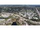 Panoramic aerial shot showcases a neighborhood with diverse housing, roads, and a peaceful body of water at 2679 Sabal Springs Cir # 102, Clearwater, FL 33761
