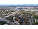 Beautiful aerial view showcasing the community's layout, pond, and nearby amenities at 2679 Sabal Springs Cir # 102, Clearwater, FL 33761