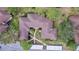 Birds eye view of the building showing roof style, walkways, parking, and well-manicured lawns at 2679 Sabal Springs Cir # 102, Clearwater, FL 33761