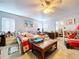 Spacious bedroom with a ceiling fan, bedside tables, and closet space at 2679 Sabal Springs Cir # 102, Clearwater, FL 33761
