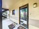 A picture of the entrance with new welcome mats and a glimpse of the unit number and interior at 2679 Sabal Springs Cir # 102, Clearwater, FL 33761