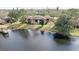 Condo complex nestled by a lake offering serene views and community charm at 2679 Sabal Springs Cir # 102, Clearwater, FL 33761