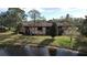 Exterior view of condos with lake views and lush landscaping at 2679 Sabal Springs Cir # 102, Clearwater, FL 33761