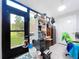 Bright sunroom with large windows offering views of the backyard at 2679 Sabal Springs Cir # 102, Clearwater, FL 33761