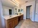 Bright bathroom featuring a double vanity, neutral paint, and tile floors at 2820 Pankaw Ln, Valrico, FL 33596