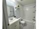 Cozy bathroom featuring a shower-tub combo, patterned floor, and mirrored vanity at 2820 Pankaw Ln, Valrico, FL 33596