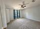 Cozy bedroom with a ceiling fan, closet, and carpet floors at 2820 Pankaw Ln, Valrico, FL 33596