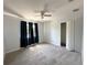 Bedroom featuring new carpet, closet, and a ceiling fan at 2820 Pankaw Ln, Valrico, FL 33596