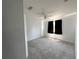 Bedroom with a ceiling fan, carpet, and a pair of windows at 2820 Pankaw Ln, Valrico, FL 33596