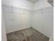 Walk-in closet with carpet floors and wire shelving ready to organize your wardrobe at 2820 Pankaw Ln, Valrico, FL 33596