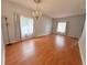 Traditional dining room featuring hardwood floors and elegant chandelier at 2820 Pankaw Ln, Valrico, FL 33596