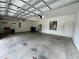 Spacious and clean garage with ample room for parking and storage, featuring an automatic door opener at 2820 Pankaw Ln, Valrico, FL 33596