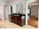 The kitchen boasts dark wood cabinets, stainless steel appliances, and is open to the living area at 2820 Pankaw Ln, Valrico, FL 33596