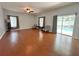 Spacious living room features wood floors and access to a pool at 2820 Pankaw Ln, Valrico, FL 33596