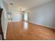 An open living room showcases wood floors, a chandelier, and neutral paint, creating a comfortable atmosphere at 2820 Pankaw Ln, Valrico, FL 33596
