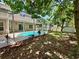 Beautiful screened in pool with a well landscaped yard and mature trees at 2820 Pankaw Ln, Valrico, FL 33596