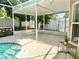 Spacious pool deck area with a covered lanai and a view of the backyard at 2820 Pankaw Ln, Valrico, FL 33596