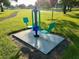 Outdoor exercise equipment on manicured lawns providing an active community at 2820 Pankaw Ln, Valrico, FL 33596