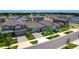 Aerial view of a modern neighborhood with a lake and well-maintained homes at 3078 Marine Grass Dr, Wimauma, FL 33598