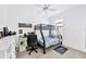 Cozy bedroom featuring a bunk bed, desk, and gaming setup for a fun and functional space at 3078 Marine Grass Dr, Wimauma, FL 33598