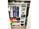 Well-organized closet featuring shelving, hanging rods, and a safe for secure storage of valuables at 3078 Marine Grass Dr, Wimauma, FL 33598
