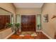 Inviting front entrance featuring double doors, beautiful hardwood floors and stylish decor at 3138 Edgemoor Dr, Palm Harbor, FL 34685