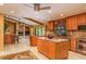 Spacious kitchen with granite countertops, stainless steel appliances and an island at 3138 Edgemoor Dr, Palm Harbor, FL 34685