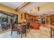 Open kitchen featuring wood cabinets, granite countertops, and views of the outdoor living space at 3138 Edgemoor Dr, Palm Harbor, FL 34685
