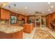 A large kitchen with granite counters, stainless appliances, and an open design to the living area at 3138 Edgemoor Dr, Palm Harbor, FL 34685
