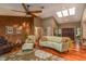 Bright living room features hardwood floors, a ceiling fan, vaulted ceilings and lots of natural light at 3138 Edgemoor Dr, Palm Harbor, FL 34685