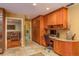 Office space adjoining the kitchen area, with built-in cabinets and desk space, plus a view to laundry area at 3138 Edgemoor Dr, Palm Harbor, FL 34685