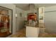 An outdoor kitchen is equipped with stainless steel appliances and granite countertops, perfect for outdoor entertaining at 3138 Edgemoor Dr, Palm Harbor, FL 34685