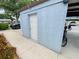 Light blue exterior with white door, bike, and walkway at 3311 Teeside Dr, New Port Richey, FL 34655