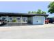 Exterior showing a car port with a compact car parked to the left and an SUV to the right at 3311 Teeside Dr, New Port Richey, FL 34655