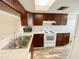Bright kitchen with updated appliances, wood cabinetry, and ample counter space at 3311 Teeside Dr, New Port Richey, FL 34655