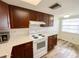 Cozy kitchen featuring wood cabinets, modern appliances, and bright countertops at 3311 Teeside Dr, New Port Richey, FL 34655